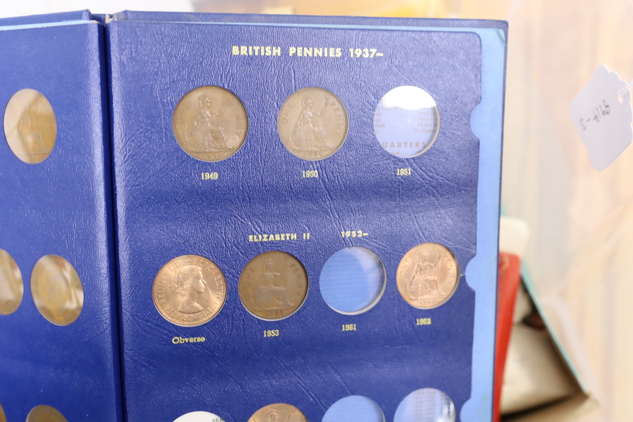 A box of UK and World coins including George V and George VI florins, shillings etc